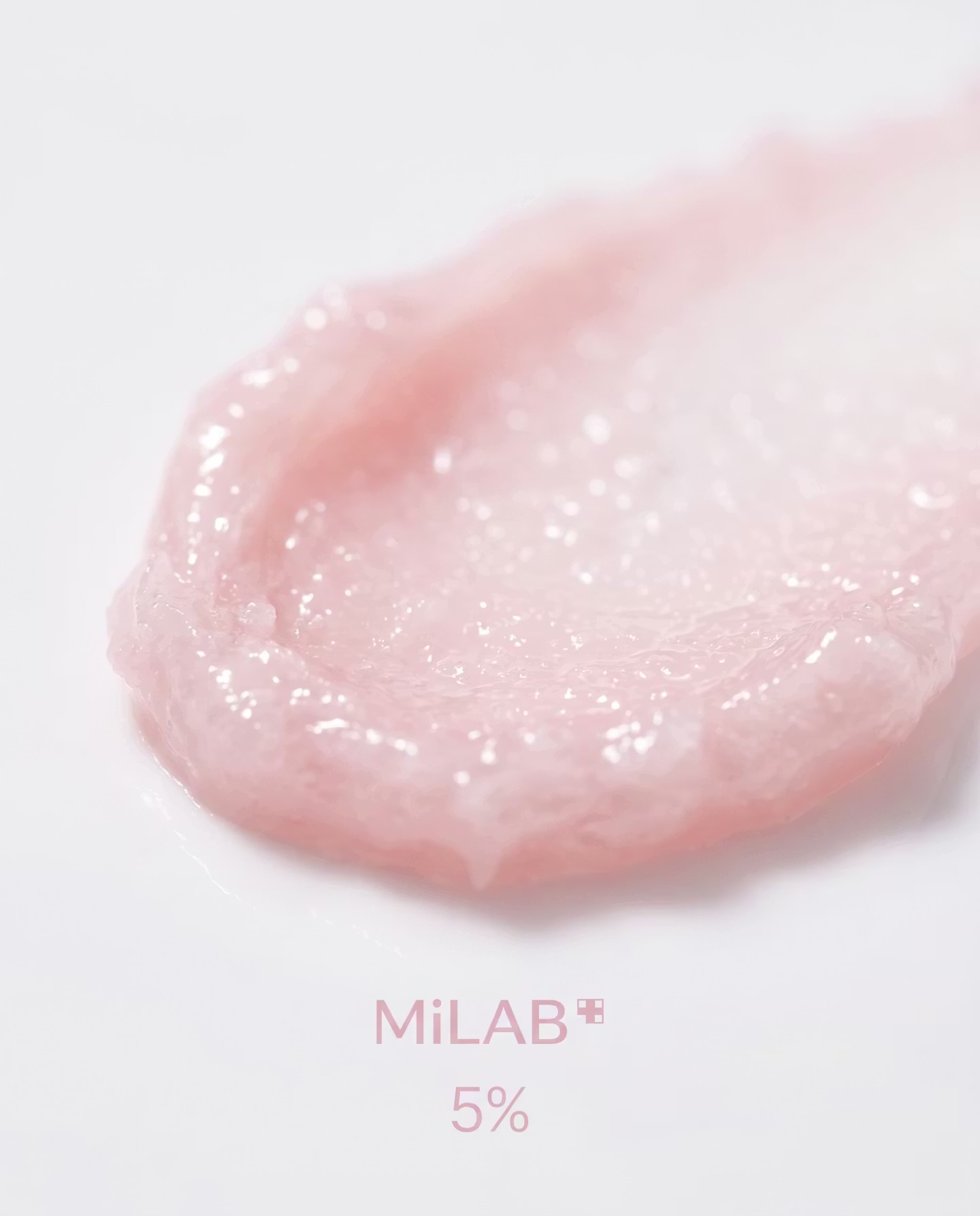 Macro de la texture rose du baume Milab